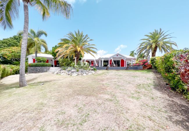 View of the large, perfectly manicured tropical garden surrounding a luxury villa in the West Indies