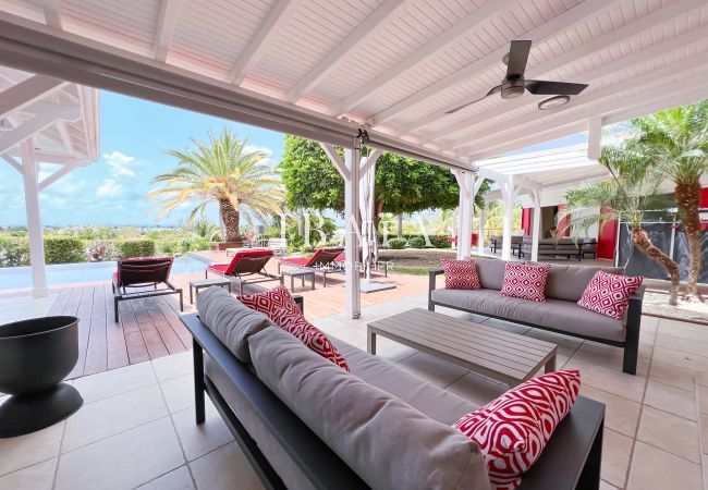 Outdoor terrace with lounge and pool view