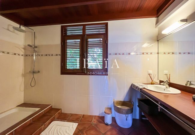 Large bathroom with walk-in shower and exposed woodwork