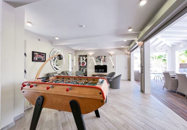Finely decorated and equipped interior lounge with TV and table football