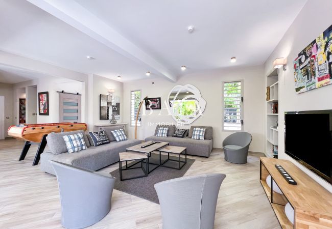 Finely decorated and equipped interior lounge with TV and table football