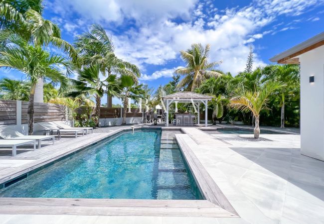 Superb Bali style salt water pool with 2 pools and 2 semi-submerged beaches for safe sunbathing in the water.