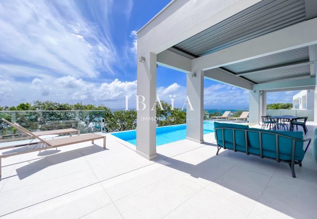 Deckchairs and shaded terrace with pergolas