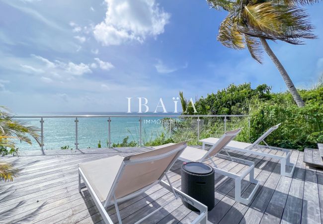 Sunbathing terrace with deckchair and ocean view not overlooked