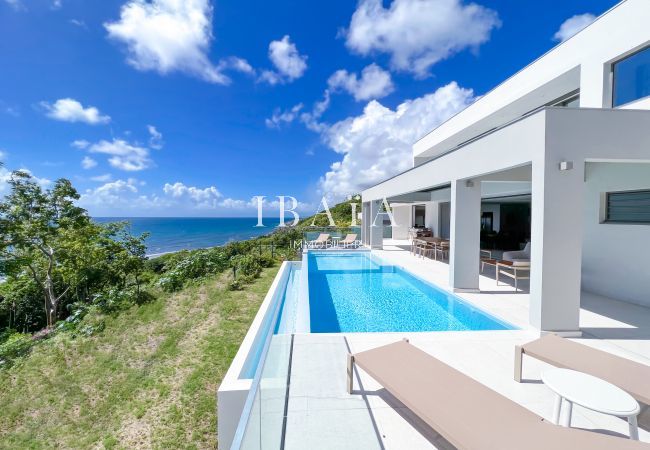 View of the pool terrace and the ocean