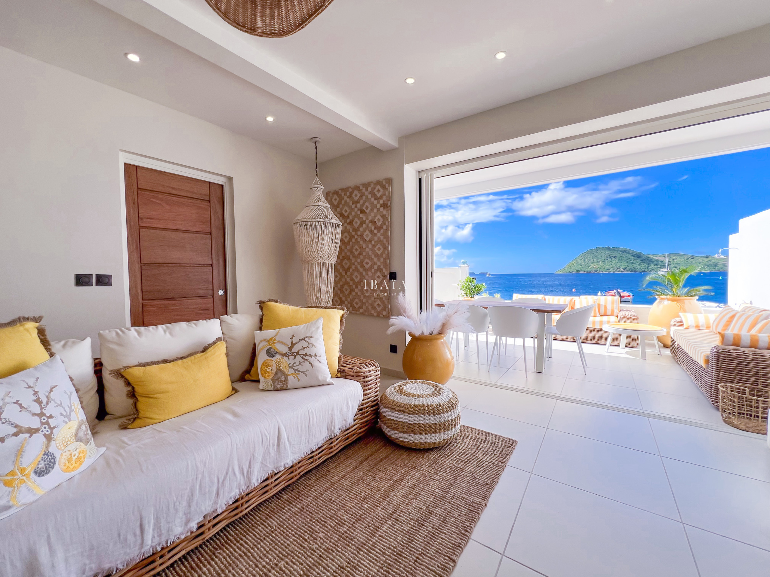 View from a living room to a terrace and the sea
