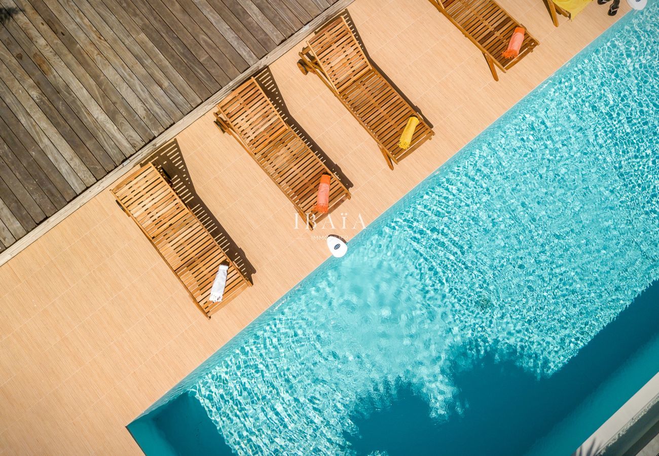 Drone view of the deckchairs and the pool