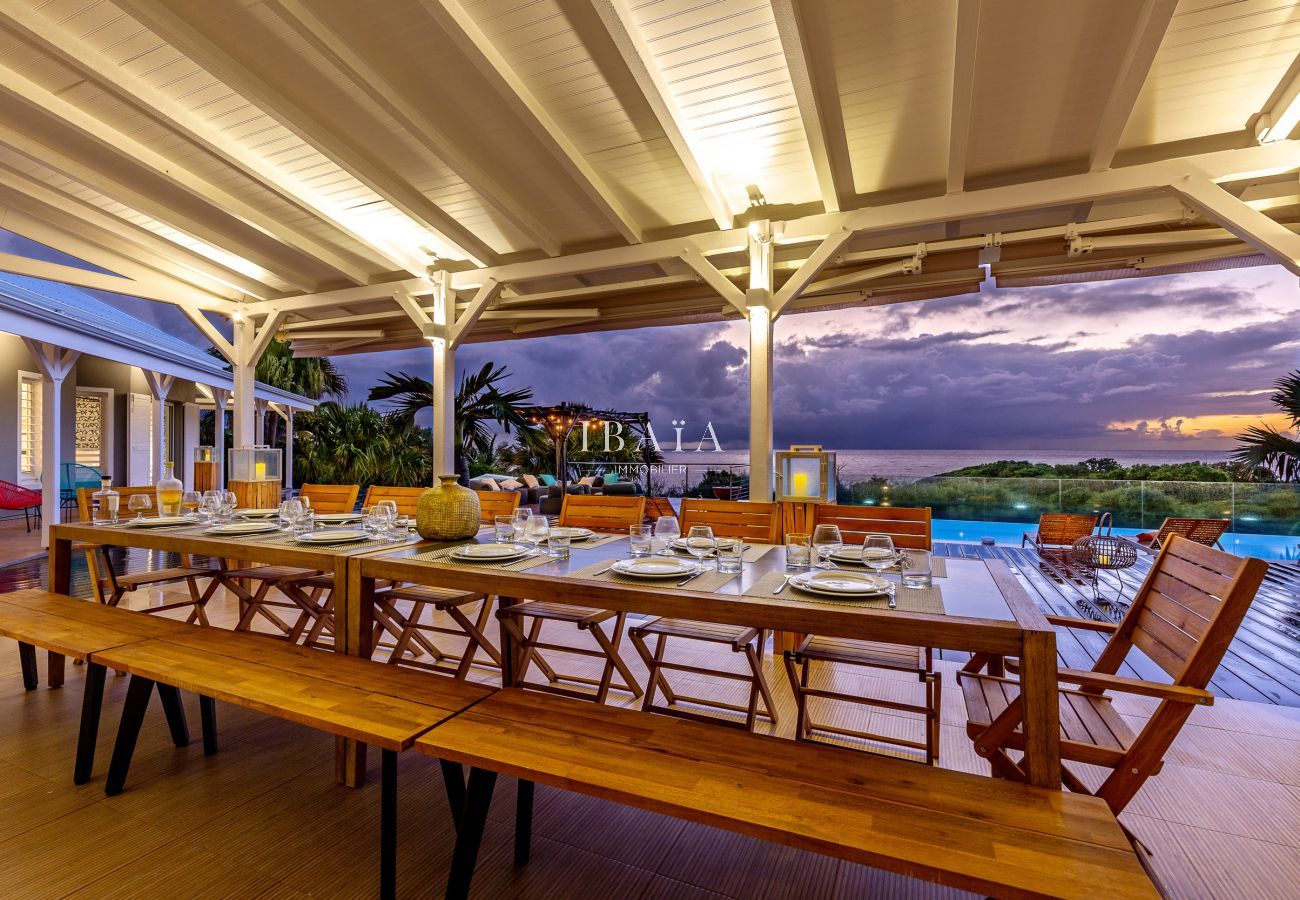beautiful dining table for 12-14 persons with view on the pool and the ocean 