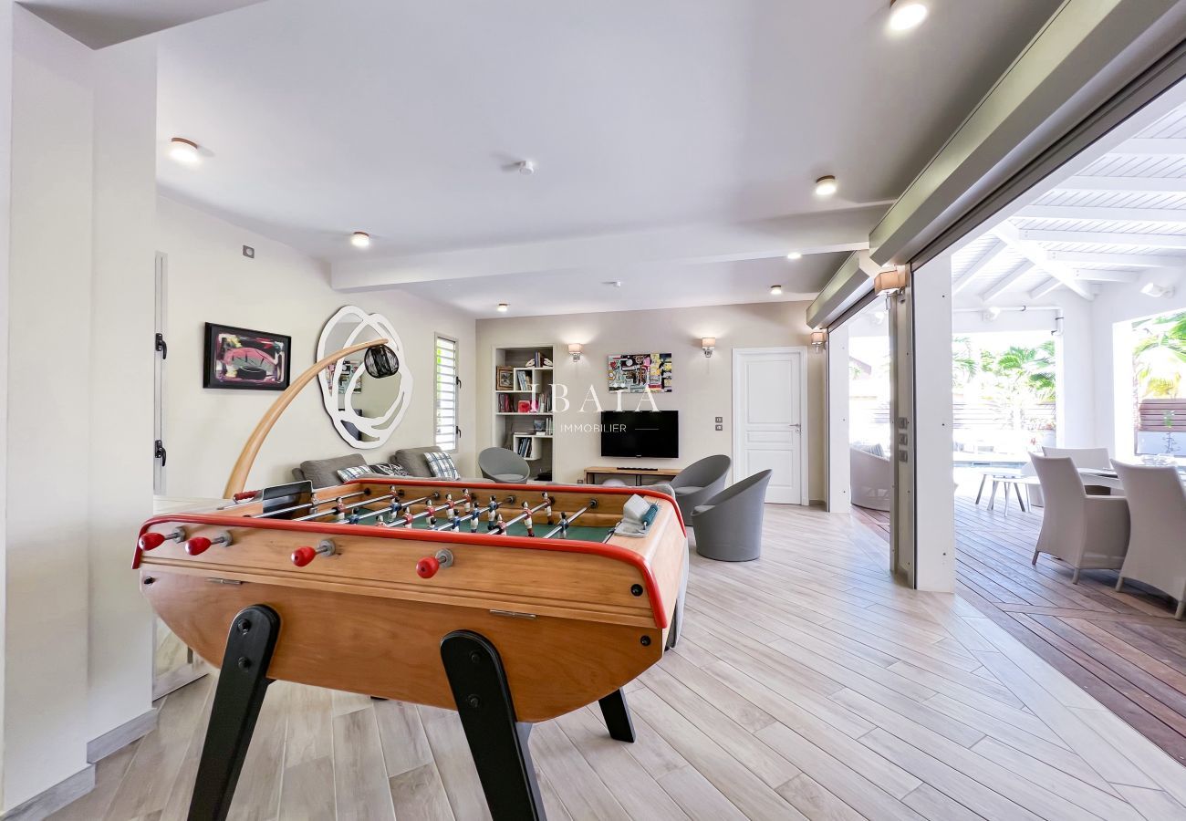 Finely decorated and equipped interior lounge with TV and table football
