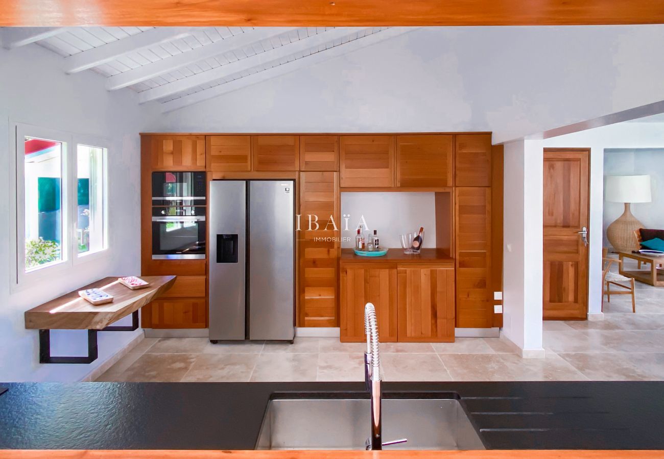 Beautiful open kitchen with fully equipped American refrigerator