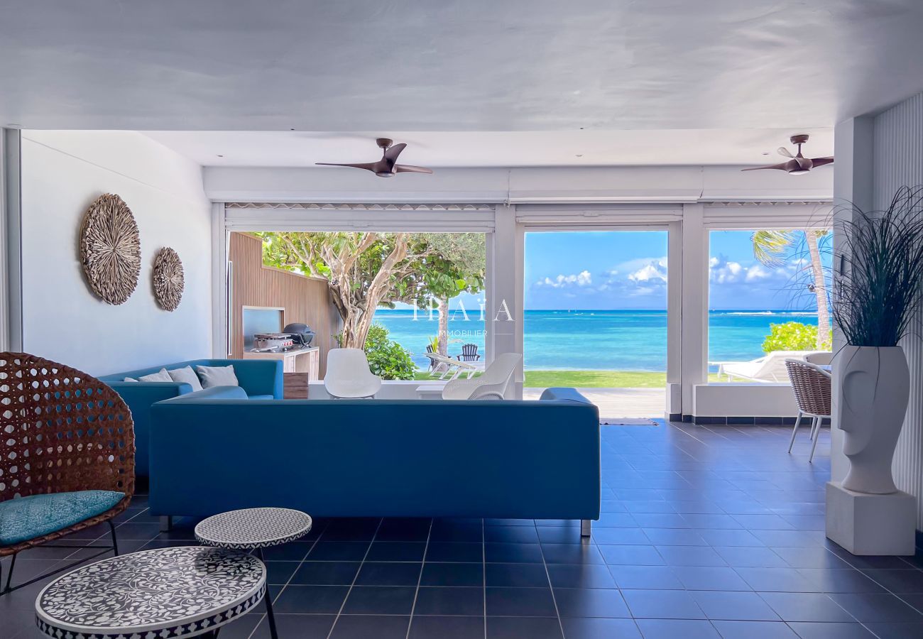 Modern interior, glass doors and sea view