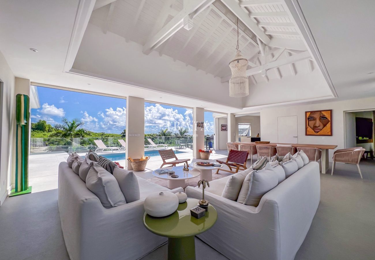 Bright living space with pool view